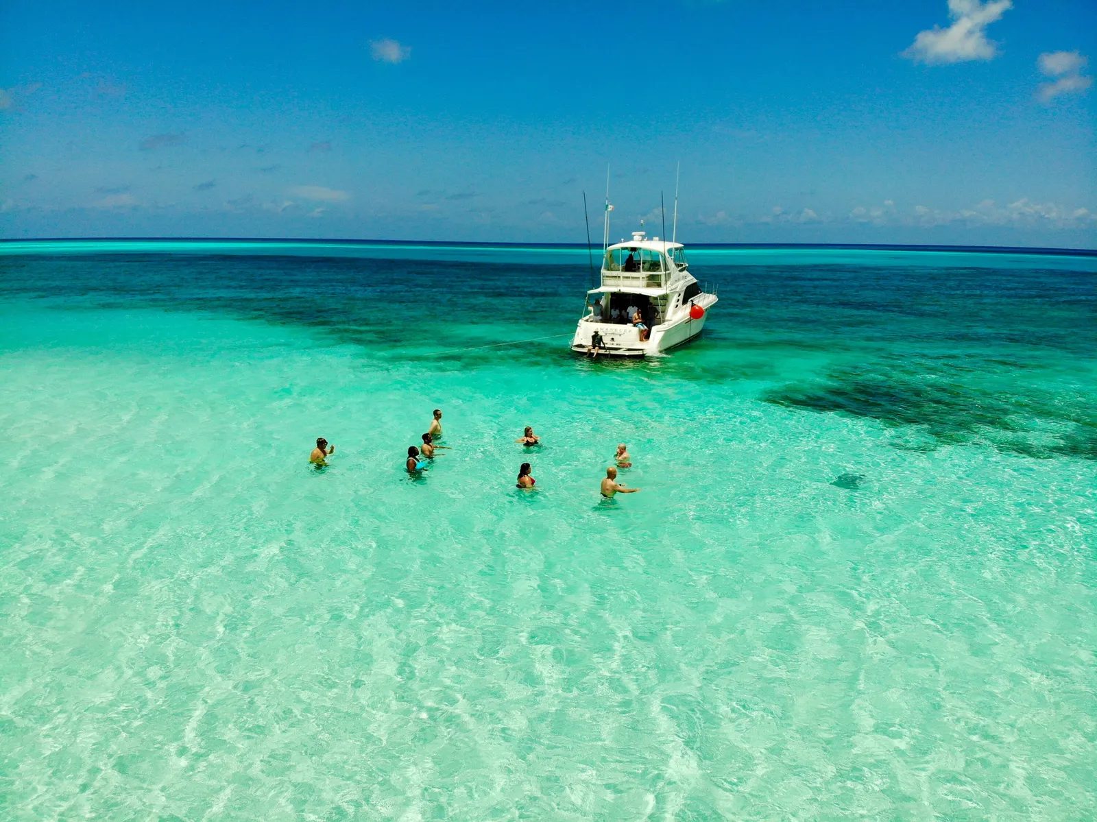 Boat and turquoise reef waters near Cozumel, México